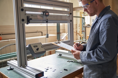 image engineering lab plus person with safety glasses